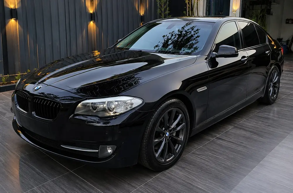 Black BMW sedan after ceramic coating at Kanak Car Care