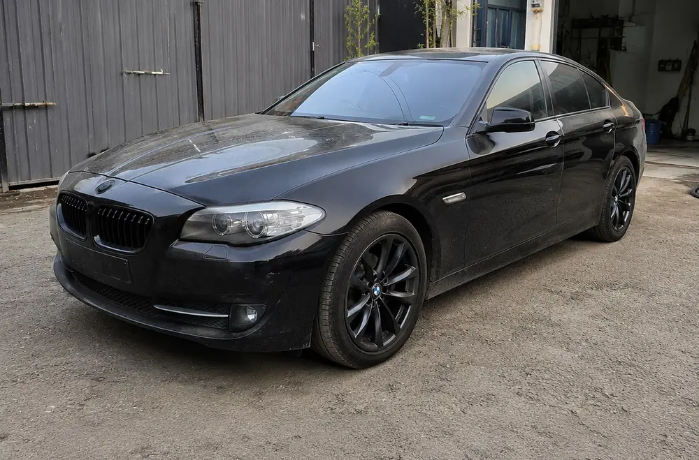 Black BMW sedan before ceramic coating at Kanak Car Care